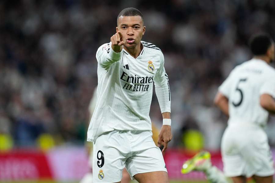 Real Madrid's Kylian Mbappe celebrates a goal scored by Jude Bellingham against Real Sociedad