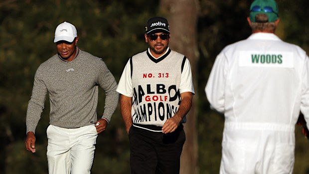 Tiger Woods of the United States and Jason Day of Australia walk the 15th fairway during the continuation of the first round of the 2024 Masters Tournament at Augusta National Golf Club on April 12, 2024 in Augusta, Georgia. (Photo by Jamie Squire/Getty Images)