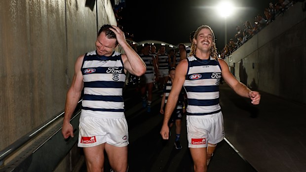 Patrick Dangerfield (left) and Bailey Smith of the Cats celebrate during a match at Adelaide Oval.