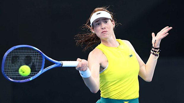 Maya Joint of Australia plays a shot against Yulia Putintseva of Kazakhstan.