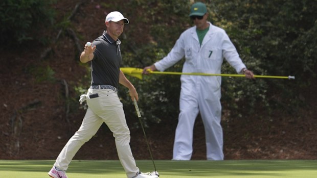 Rory McIlroy, of Northern Ireland, waves after making a putt on the 12th hole during the second round at the Masters golf tournament, Friday, April 11, 2025, in Augusta, Ga. (AP Photo/Matt Slocum)