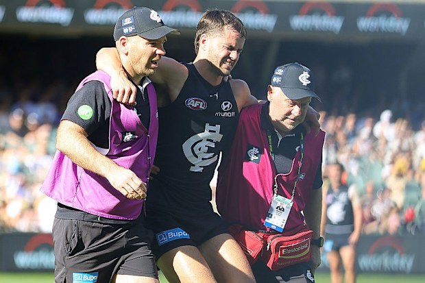 Brodie Kemp of the Blues being taken off the field due to a leg injury.