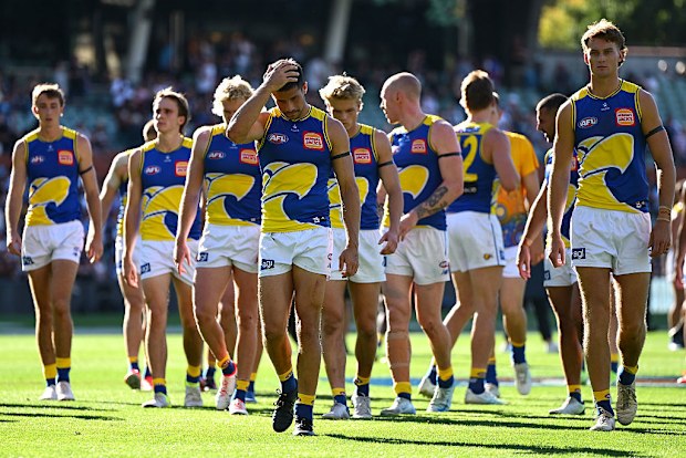 The Eagles appear dejected after their round five AFL loss to the Carlton Blues.