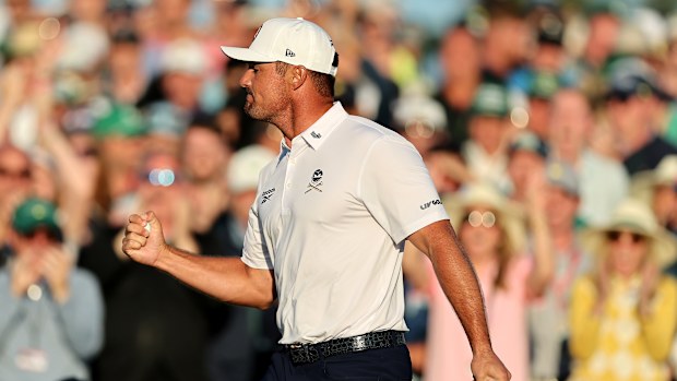 Bryson DeChambeau of the United States reacts on the 18th green during the third round of the 2025 Masters Tournament at Augusta National Golf Club on April 12, 2025 in Augusta, Georgia. (Photo by Michael Reaves/Getty Images)