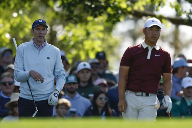 Michael McDermott and Tom Kim of Korea observe from the fourth tee during the third round of the 2025 Masters Tournament at Augusta National Golf Club on April 12, 2025 in Augusta, Georgia. (Photo by Harry How/Getty Images)