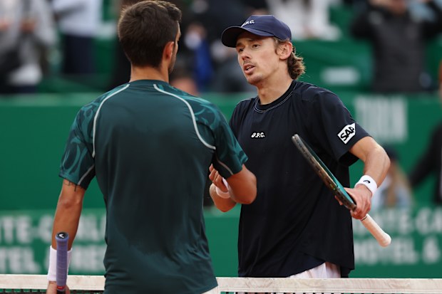 Lorenzo Musetti receives congratulations from Alex De Minaur after his semi-final match at the Monte-Carlo Masters.