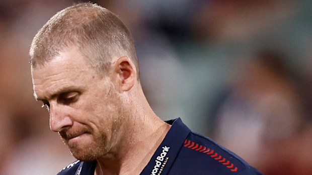 Simon Goodwin, Senior Coach of the Demons shows signs of disappointment after a loss
