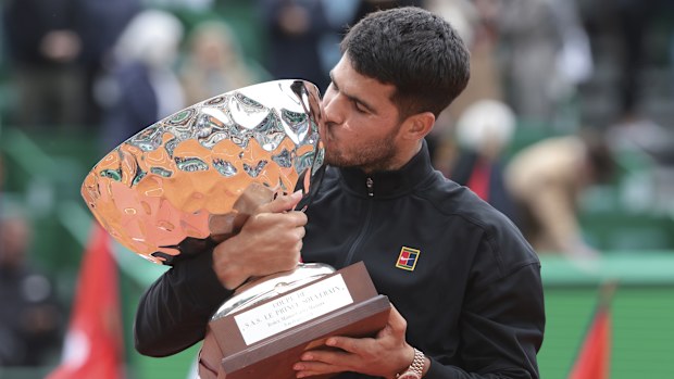 Carlos Alcaraz celebrates with the trophy after winning the Men's Final of the Rolex Monte-Carlo Masters.