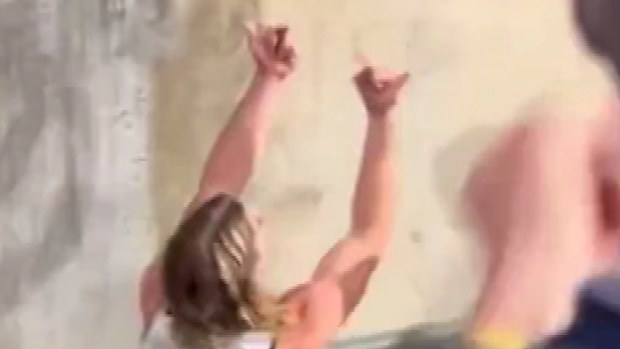 Bailey Smith flips a fan the double bird after the Cats' Gather Round win over the Adelaide Crows.