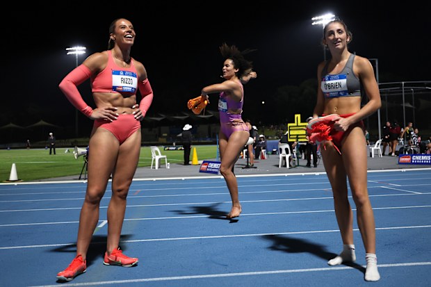 Torrie Lewis (centre) celebrates after the confirmation from the judges, as Bree Rizzo (left) and Leah O'Brien were left with the minor medals.