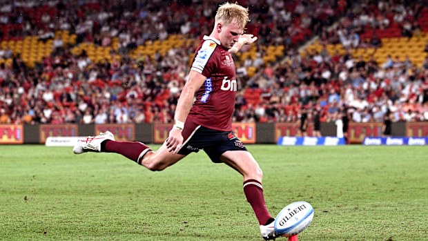 Tom Lynagh of the Reds kicks a conversion at Suncorp Stadium.