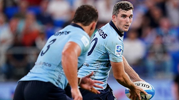 Lawson Creighton of the Waratahs carries the ball.