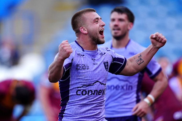 Mikey Lewis celebrates a try.