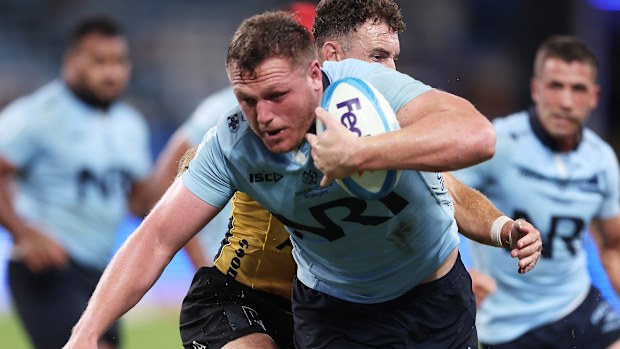 Angus Bell of the Waratahs runs with the ball.