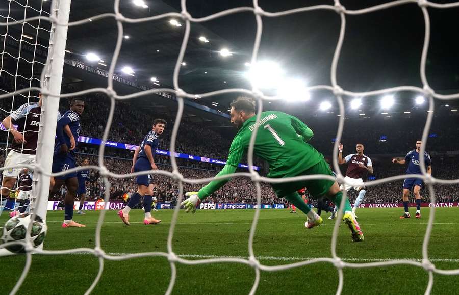 Aston Villa's Ezri Konsa scores his side's third goal of the game past Paris Saint-Germain goalkeeper Gianluigi Donnarumma