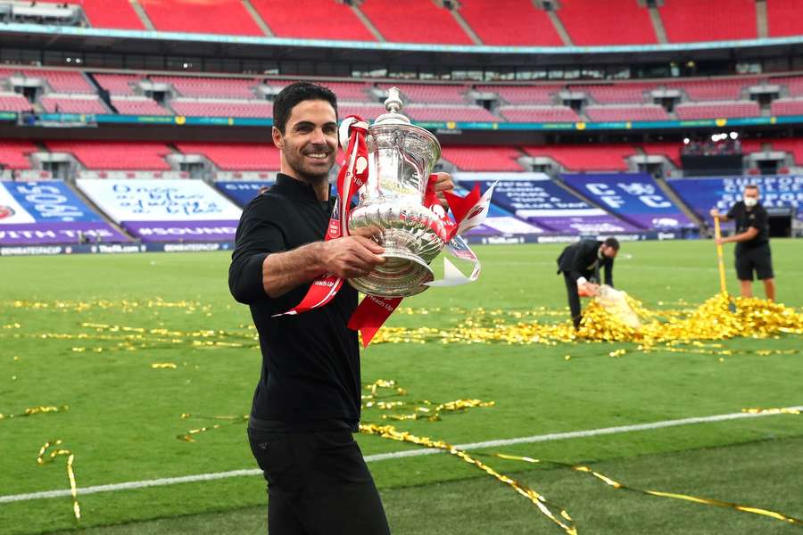 Arsenal manager Mikel Arteta celebrates their victory with the FA Cup trophy