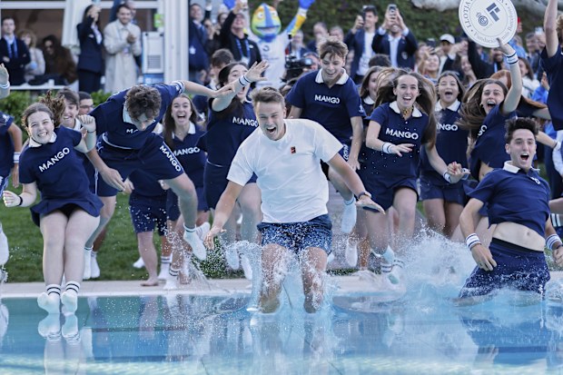 Denmark's Holger Rune jumps into a pool after winning the ATP Barcelona Open.