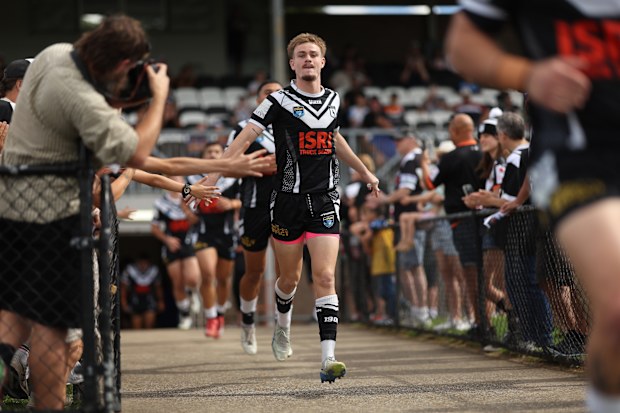 Lachlan Galvin of the Magpies runs out at the start of the NSW Cup game.