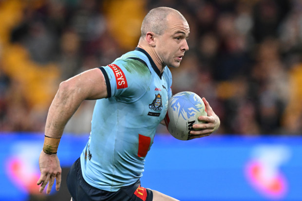 Dylan Edwards of the Blues runs the ball during game three of the 2024 Men's State of Origin series between Queensland Maroons and New South Wales Blues at Suncorp Stadium on July 17, 2024 in Brisbane, Australia. (Photo by Bradley Kanaris/Getty Images)