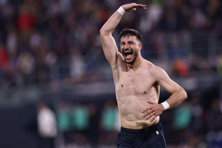 Riccardo Orsolini celebrates triumphantly after scoring against Inter Milan.