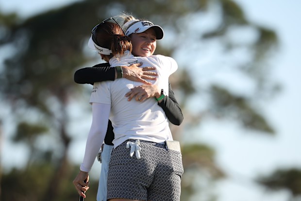 Nelly Korda of the United States and Hannah Green of Australia embrace after playing the final round of the Founders Cup.