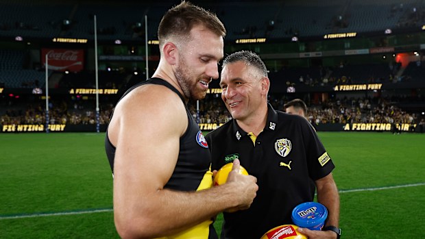 MELBOURNE, AUSTRALIA - APRIL 19: Noah Balta of the Tigers and Adem Yze, Senior Coach of the Tigers celebrating during the AFL Round 06 match between the Richmond Tigers and the Gold Coast Suns at Marvel Stadium on April 19, 2025 in Melbourne, Australia. (Photo by Michael Willson/AFL Photos via Getty Images)