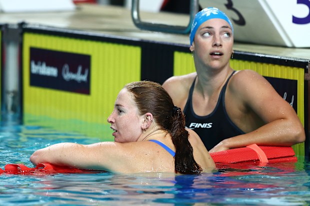 Mollie O'Callaghan (without cap) and Meg Harris after the women's 100m freestyle final at the 2025 Australian swimming championships.