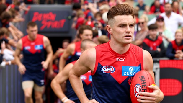 Bayley Fritsch of the Demons runs out onto the field during the round three AFL match between Melbourne Demons and Gold Coast Suns