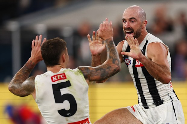 Steele Sidebottom of the Magpies celebrates a goal