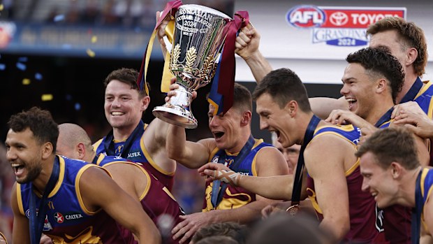 MELBOURNE, AUSTRALIA - SEPTEMBER 28: The Lions pose for a team photo after winning the AFL Grand Final match between Sydney Swans and Brisbane Lions at Melbourne Cricket Ground, on September 28, 2024, in Melbourne, Australia. (Photo by Daniel Pockett/AFL Photos/Getty Images)