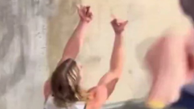 Bailey Smith gives a fan the double bird after the Cats' Gather Round victory over the Adelaide Crows.