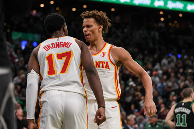 Dyson Daniels of the Atlanta Hawks celebrates a win with Onyeka Okongwu.