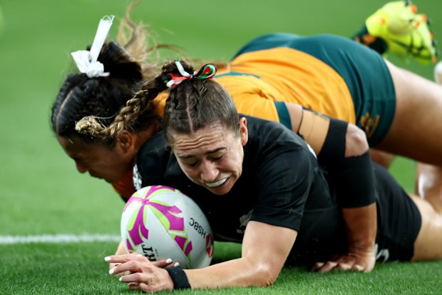 Jazmin Felix-Hotham #13 of New Zealand scores a try against Sariah Paki #65 of Australia.