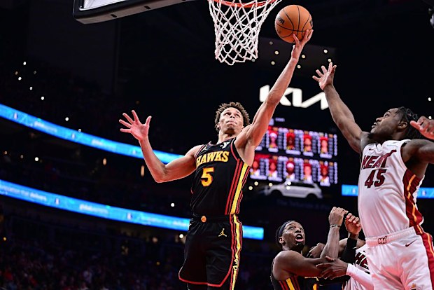 Dyson Daniels #5 of the Atlanta Hawks rebounds the ball.