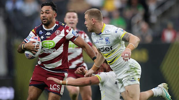 Bevan French of the Wigan Warriors runs the ball at Allegiant Stadium in Las Vegas.