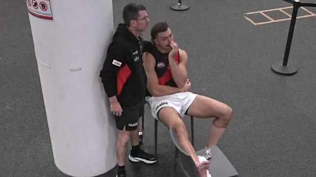 Sam Draper is consoled after suffering a leg injury.