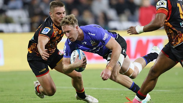 Harry Potter of the Force makes a break to score a try.