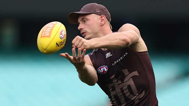 James Worpel of the Hawks handpasses during a Hawthorn Hawks AFL training