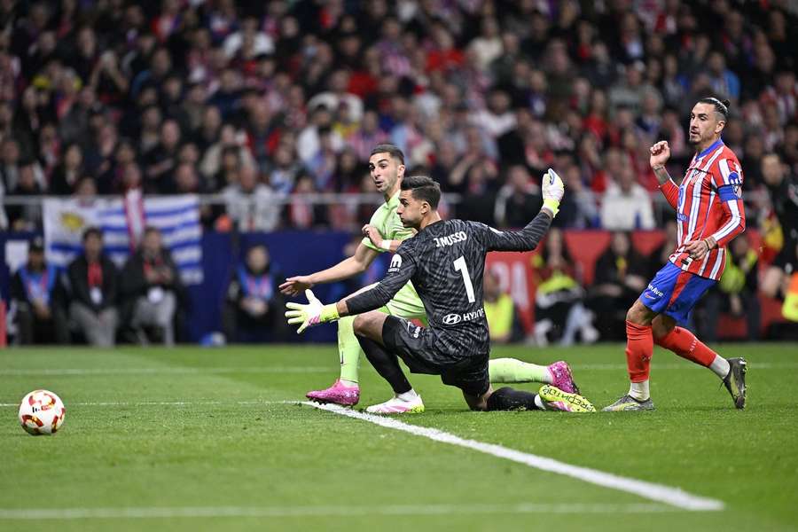 Barcelona's Ferran Torres scores the winning goal past Atletico Madrid goalkeeper, Juan Musso, during the Copa del Rey Semi Final second leg match