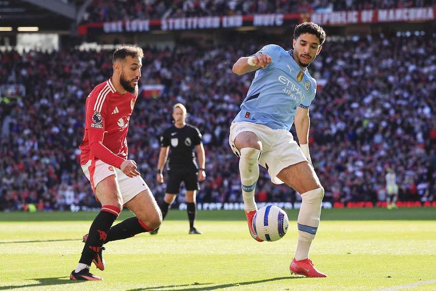 Man City's Omar Marmoush and Man United's Noussair Mazraoui during the Manchester derby on April 6th 2025