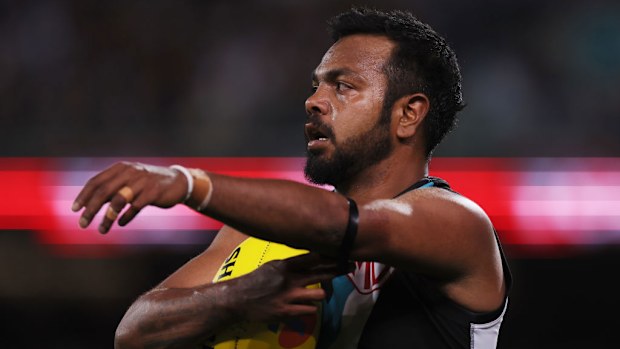 Willie Rioli of the Power preparing to kick.