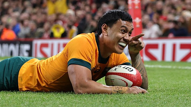 Len Ikitau of Australia celebrates after scoring their seventh try during the Autumn Nations Series 2024 match between Wales and Australia at the Principality Stadium on November 17, 2024 in Cardiff, Wales. (Photo by David Rogers/Getty Images)