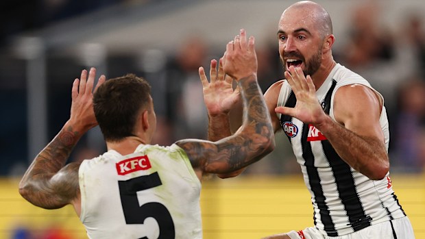 Steele Sidebottom of the Magpies celebrates a goal