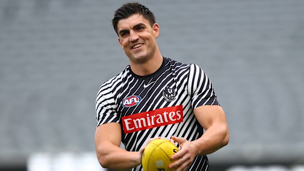 Brayden Maynard of the Magpies warms up.