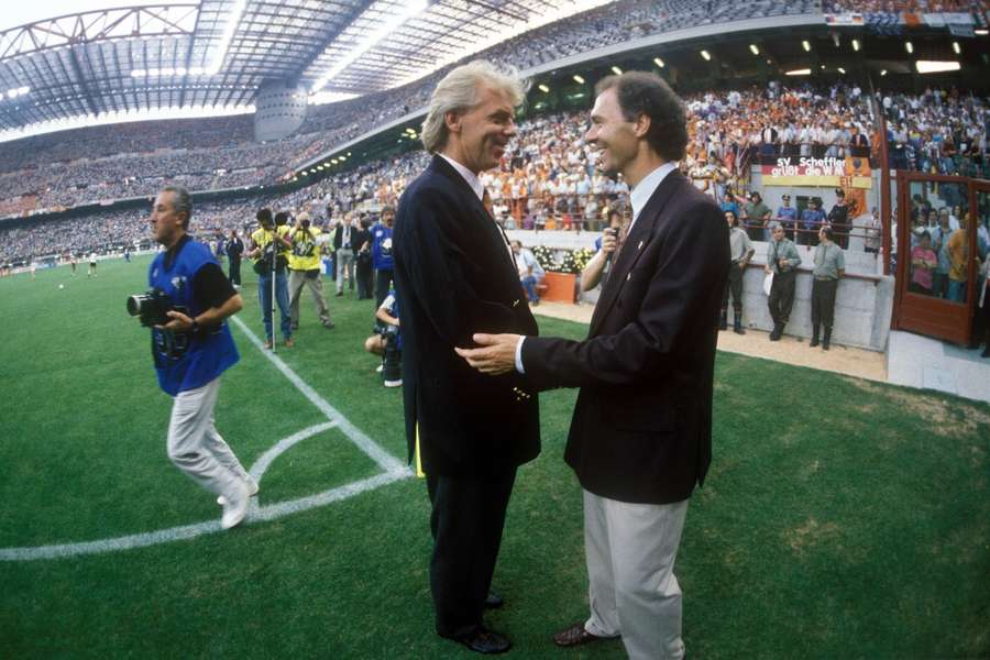 Leo Beenhakker (L) shakes Franz Beckenbauer's hand before the World Cup match between the Netherlands and Germany in 1990