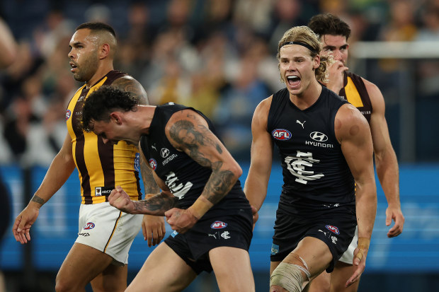 Zac Williams of the Blues (left) celebrates kicking a goal with teammate Tom De Koning (right).