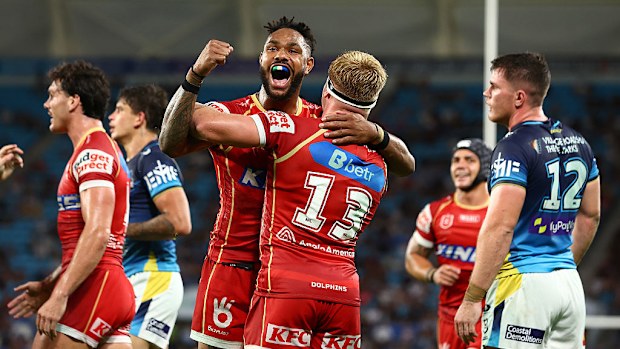 Max Plath of the Dolphins celebrates a try with Hamiso Tabuai-Fidow.