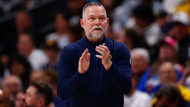 Coach Michael Malone cheers on the sidelines during the Indiana Pacers game