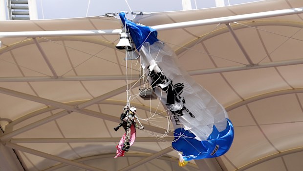 A parachutist who became snagged on the roof of the stadium.