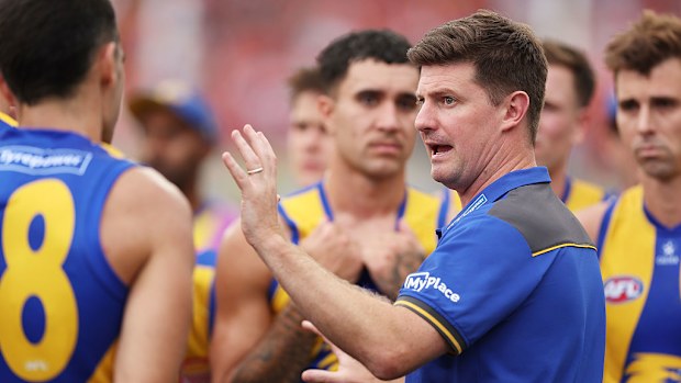 Eagles head coach Andrew McQualter speaks to players.